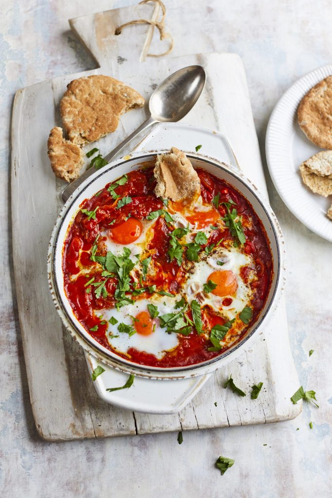 Table set with Shakshuka dish