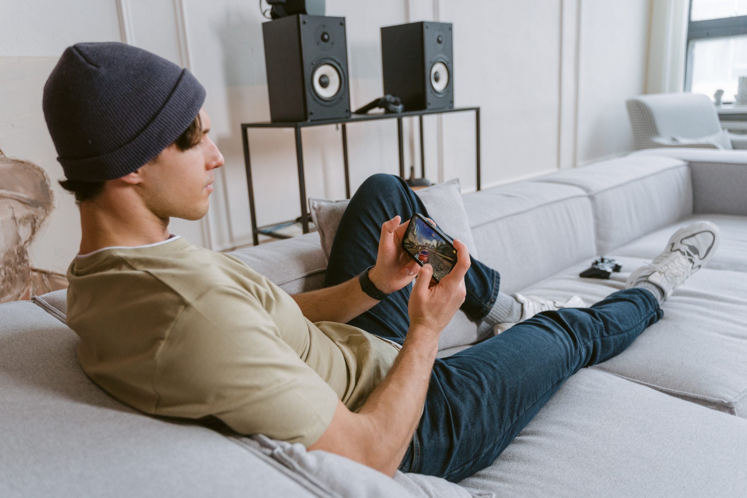 Male playing a game on a phone