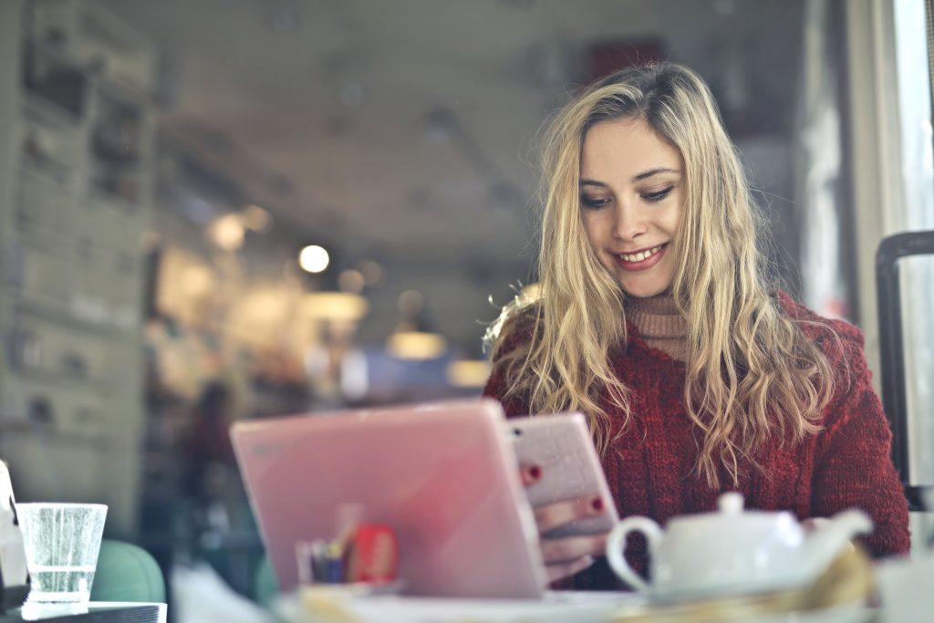 Cafe owner using technology