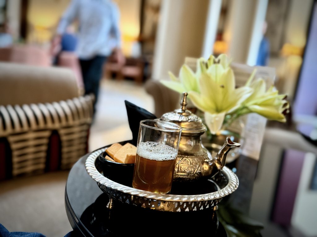 A traditional Moroccan silver teapot elegantly displayed in the luxurious lobby of the Nobu Hotel Marrakech, embodying the charm and hospitality of Moroccan culture.