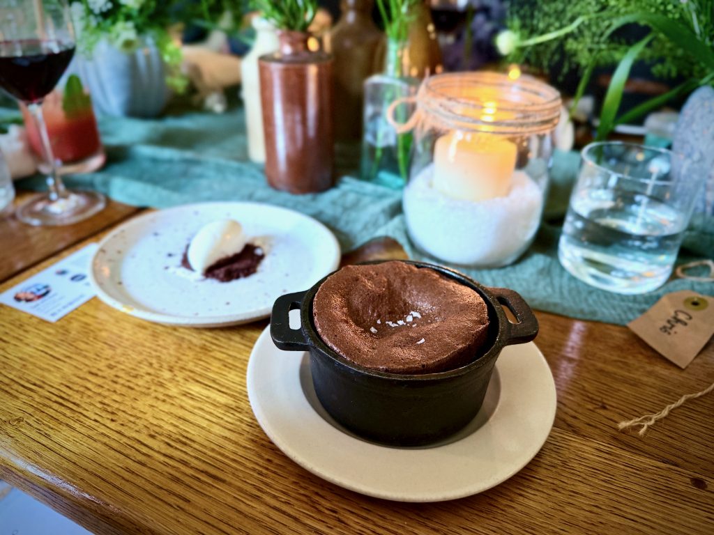 Rich chocolate fondant topped with Cornish Sea Salt flakes, served in a cast iron pot alongside raw milk ice cream at The Abbey Inn